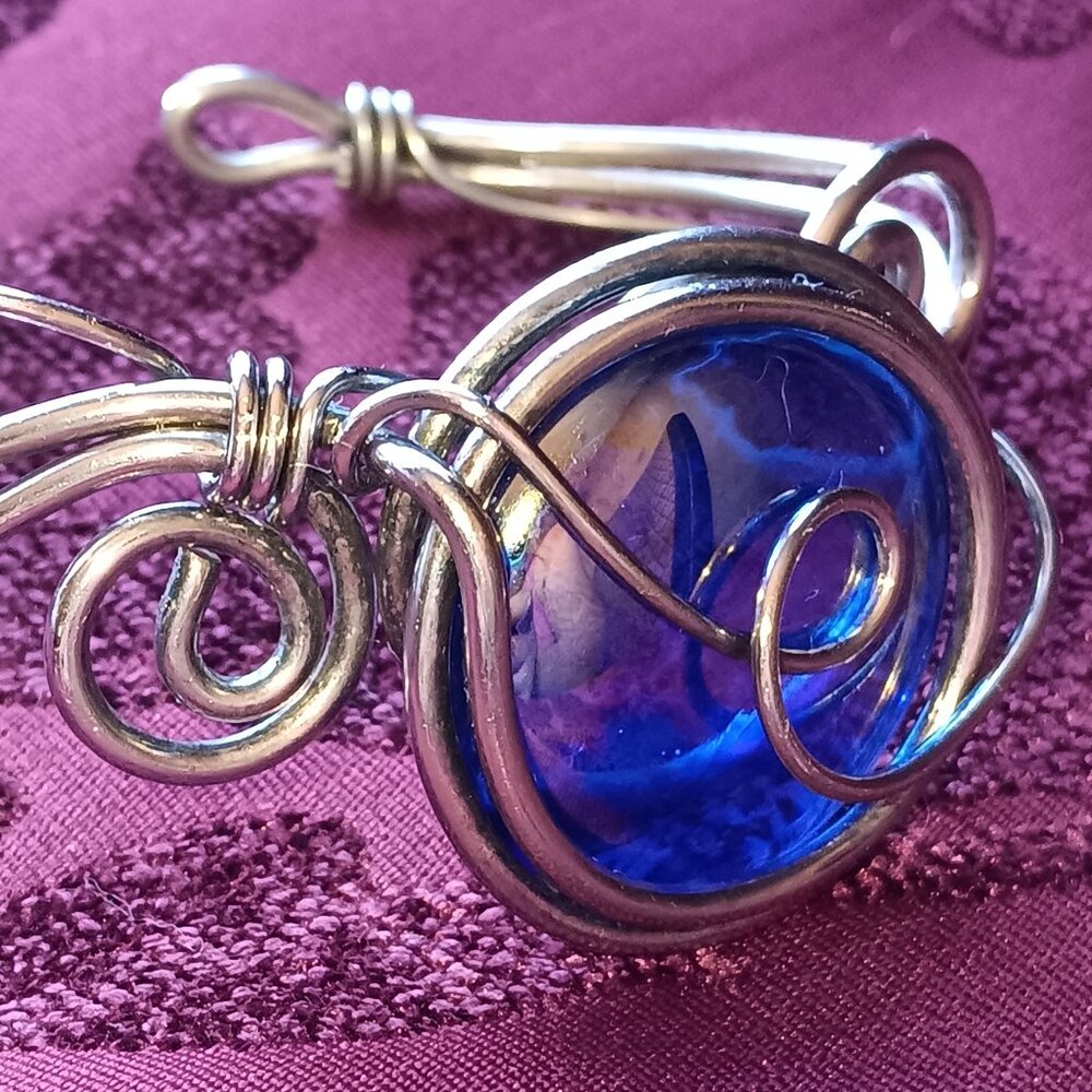 Irodescent beautiful moonstone?, in the middle of a one of a kind wire bracelet.